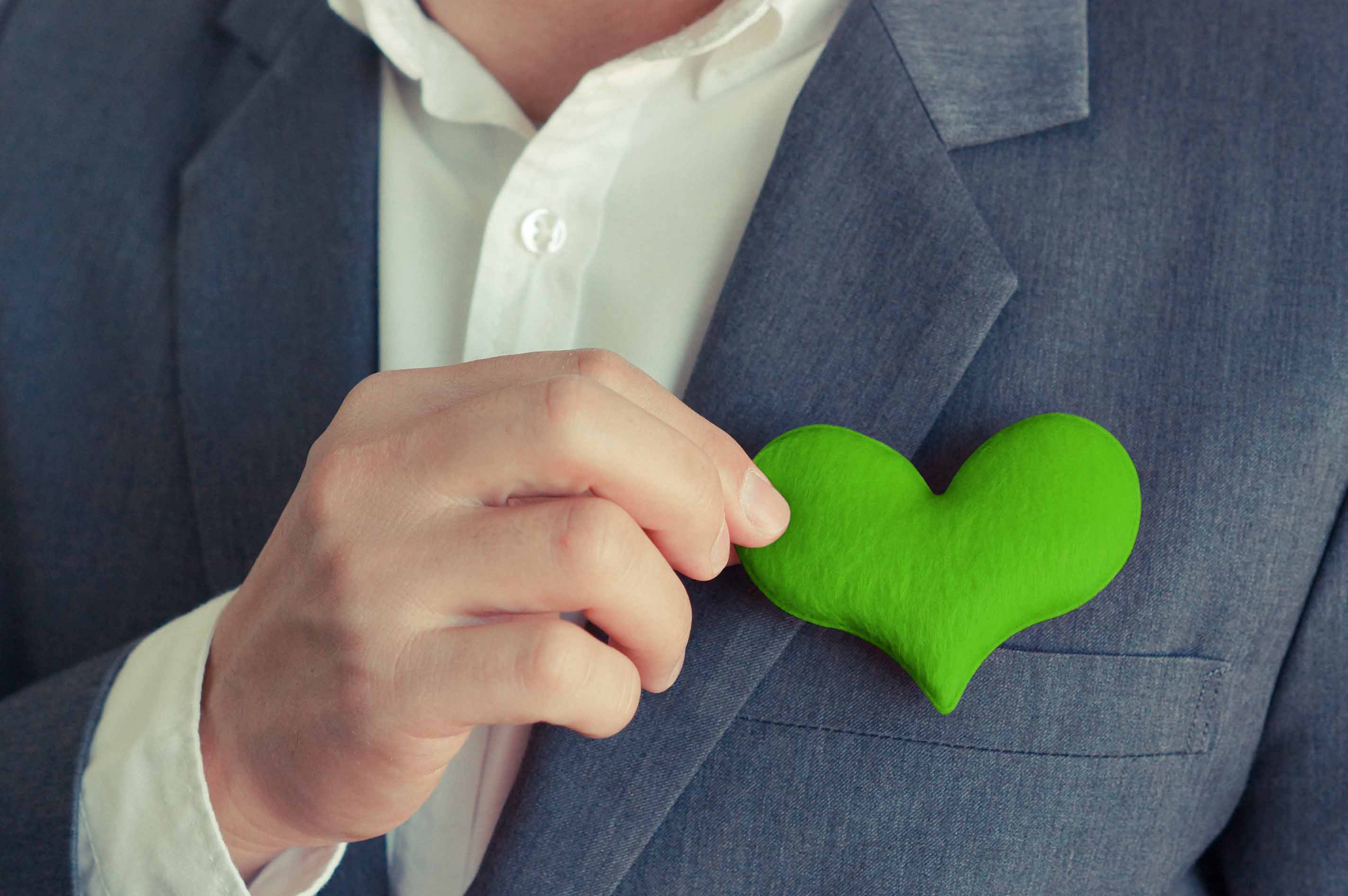 business man with green heart