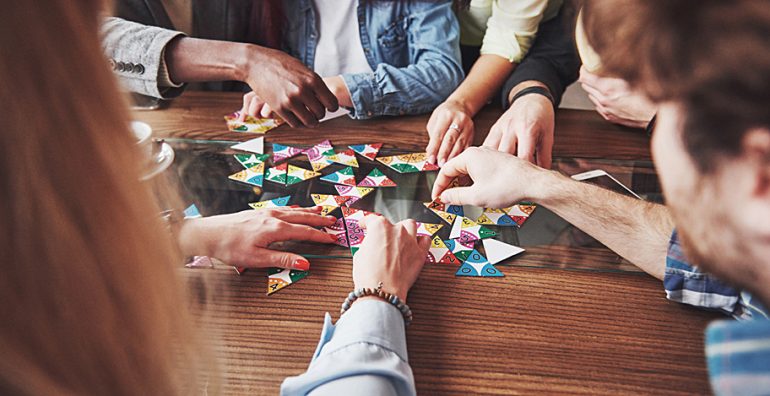 GenPop - A group playing a board game