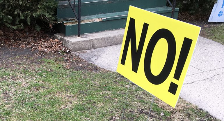 An evergreen NIMBY yard sign on display in Oak Park, Ill.