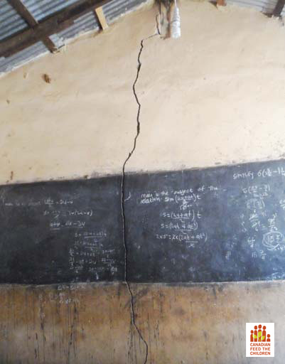 Rebuilding school in Northern Ghana broken wall