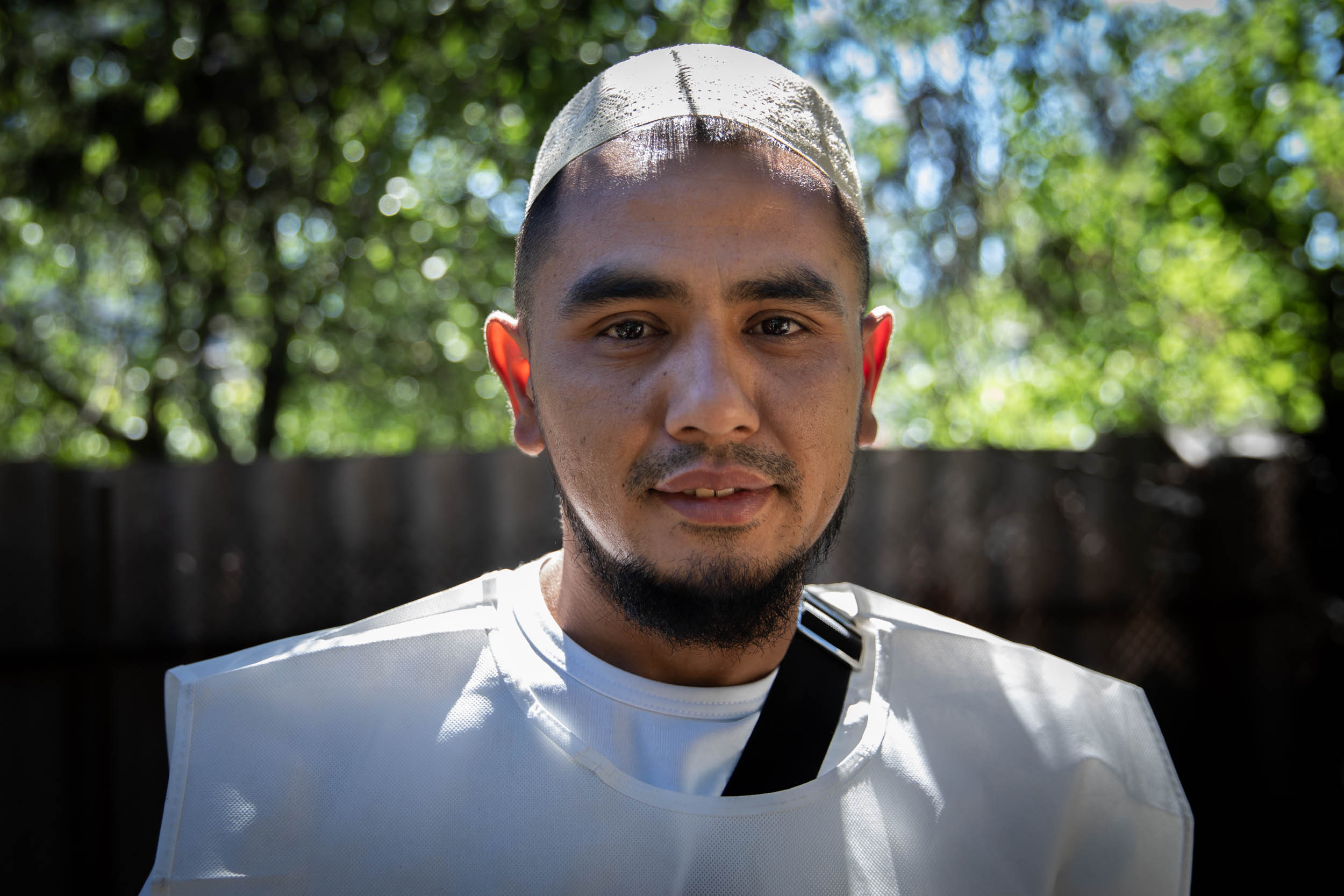 Sardor volunteers as a chef at an outdoor kitchen that serves the village of Chuhuiv in Kharkiv Oblast.