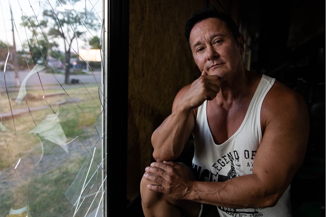 Anna at her gym in Mykolaiv, Ukraine. The window was shattered by a missile strike.