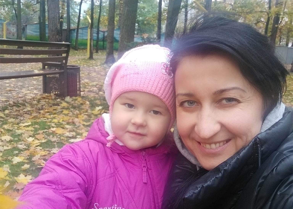 Svitlana and her daughter, Alina, outside their home in Kyiv’s Kotsyubynske neighborhood
