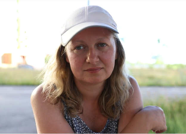 Tatyana sitting outside her home in Saltivka, Ukraine 