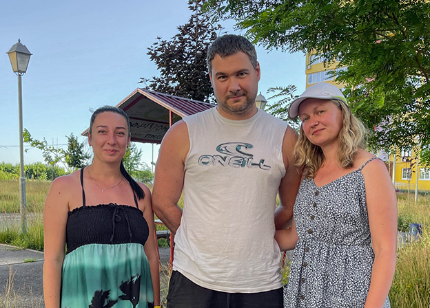 Ira (Tatyana’s friend), Volodymyr, and Tatyana outside their apartment complex in Saltivka, Ukraine