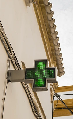Image: Display showing 41 degrees celcius on a neon sign outside a pharmacy