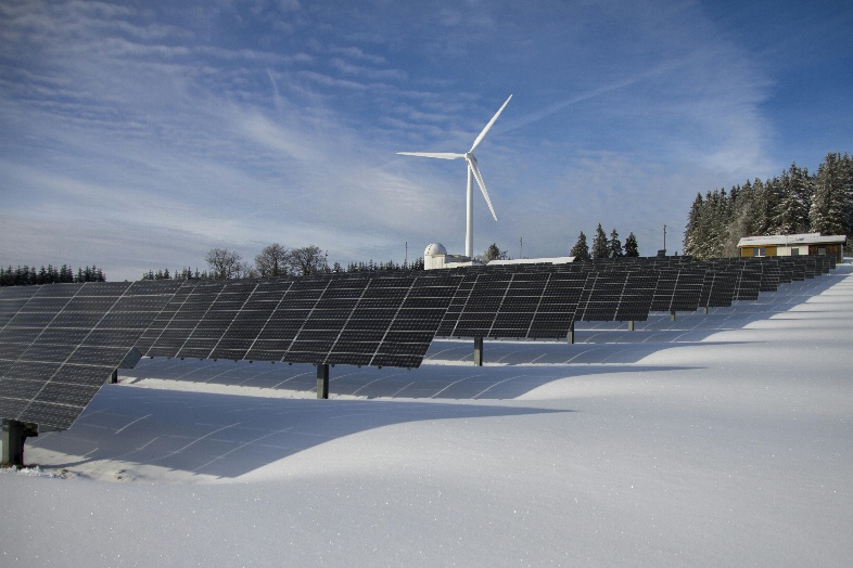 A solar panels and a wind turbine in the snow

AI-generated content may be incorrect.