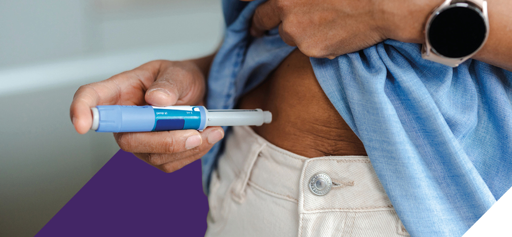 person injecting with a GLP-1 syringe