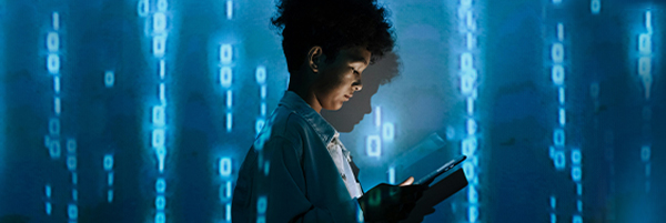 Person looking at a device against a digital background