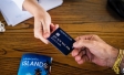 Two People Holding Premium Credit Card