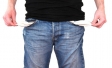 Man with hands in empty pockets