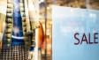 Sale sign in clothing store window