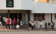 The newly unemployed queue outside their local Centrelink office