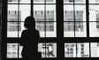 Image of woman staring out of window