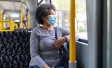 Older woman sitting on a bus, wearing face mask | Covid-19 crisis and unemployment | Ipsos