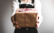 Person holding wrapped gift