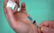 Vial and vaccine