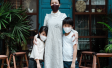 Woman with two children. All wearing masks.