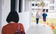 Asian Woman walking housing estate singapore