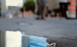 DIscarded mask in puddle
