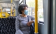 older woman sitting on bus