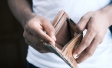 man opening empty wallet