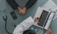 laptop-desk-doctor-patient