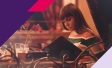Picture of a woman looking at paper menu in a restaurant