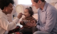 Parents feeding their child