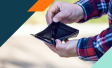 Picture of a man holding an empty wallet