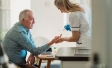 Patient and nurse conducting a diabetes test