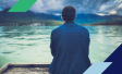 Photo of man staring out onto water