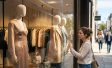 Woman staring at shopping window