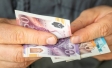A person counts cash