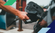 Person pumping gasoline into their car