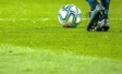 Football boots and ball