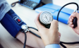 GP taking blood pressure