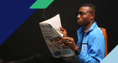 Image of a man reading a newspaper
