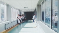 doctors looking through a glass window