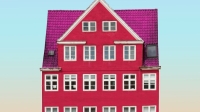 pink house front against a blue sky