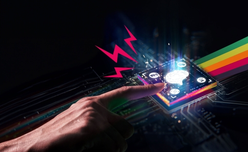 Creative|Spark AI hero image of Misfits sparks and coloured streak emerging from the microchip as a hand reaches for the microchip