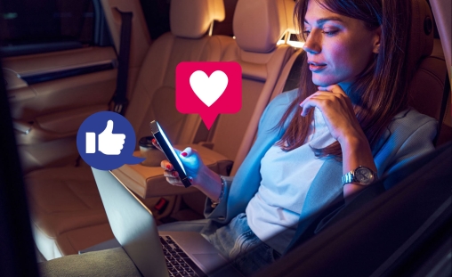 Creative Impact hero image of a woman sitting engaging with her phone and laptop while emoji overlays float from the devices