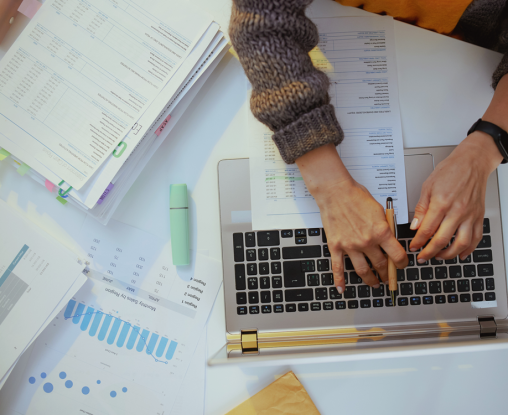 Finance documents and laptop
