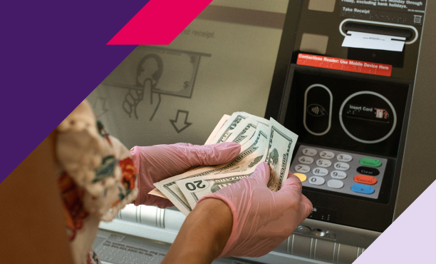 Image of woman taking cash out of an ATM