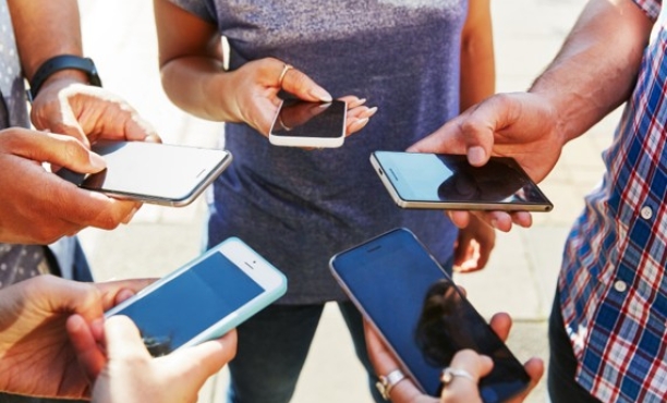 Phones held in a group