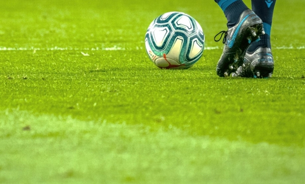 Football boots and ball