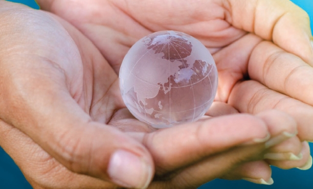 hands holding globe