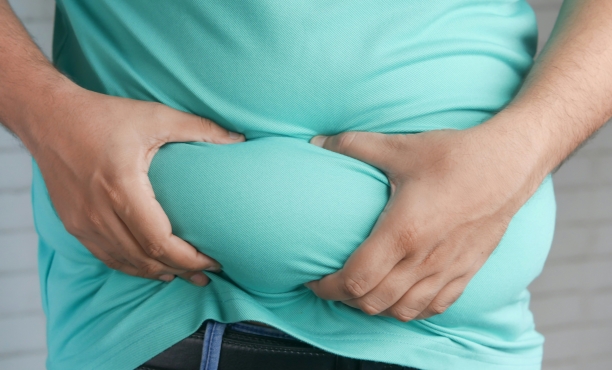 a person holding their paunch