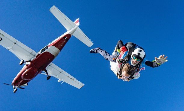 Image of someone diving out of a plane