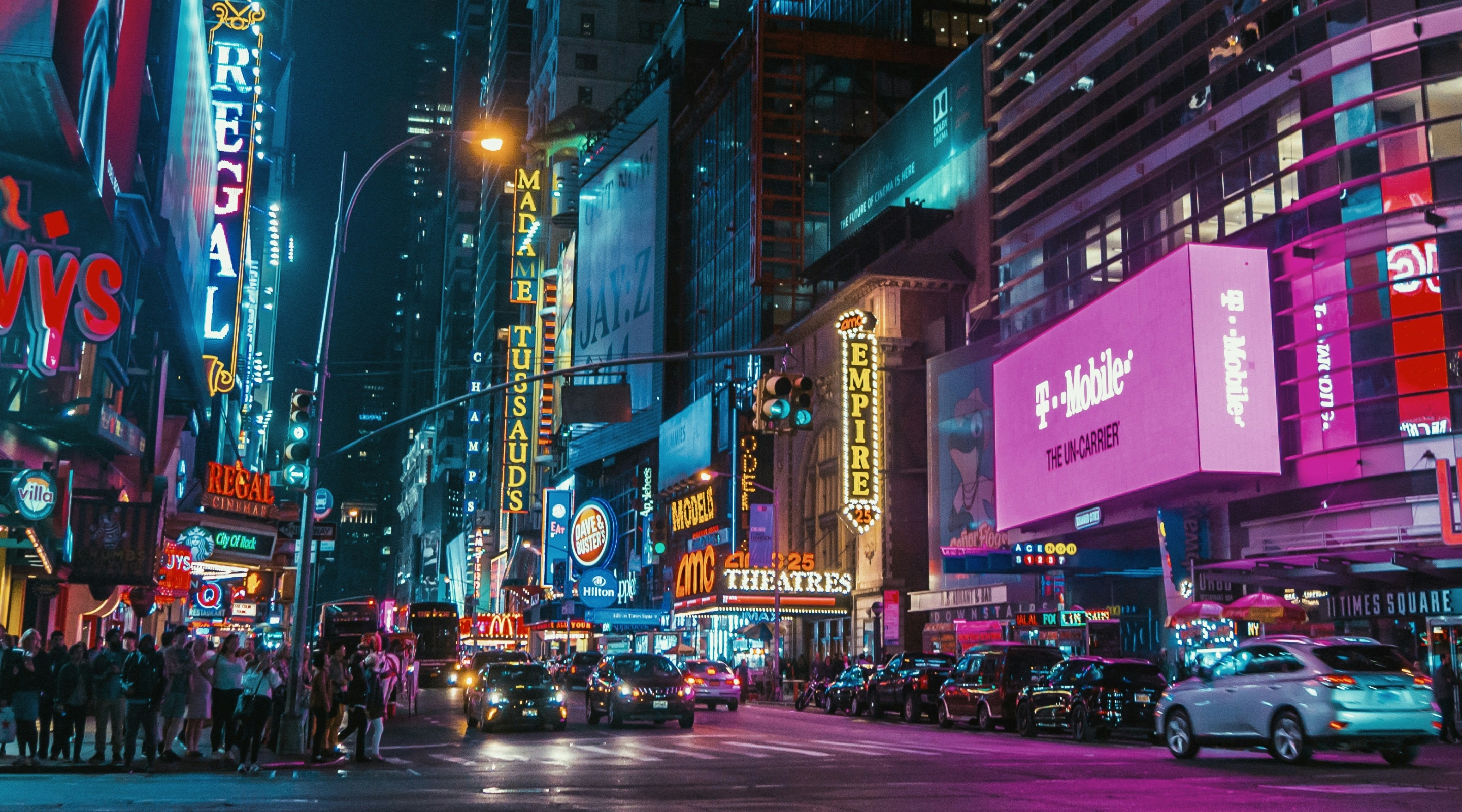 photo of a street showing neon signboards